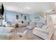 Relaxing living room with comfortable seating, fireplace, and natural light with soft blue walls at 104 Bollienger Dr, Princeton, NC 27569