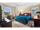 Comfortable bedroom with natural light, two windows, a stylish bed, and classic decor at 104 Bollienger Dr, Princeton, NC 27569