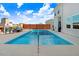 Backyard pool area with lounge chairs, a built-in outdoor kitchen, and privacy fence at 104 Bollienger Dr, Princeton, NC 27569