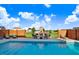 Inviting backyard pool area with comfortable seating, an outdoor fireplace, and a serene ambiance at 104 Bollienger Dr, Princeton, NC 27569