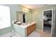 This bathroom boasts a double sink vanity and tub in a relaxing, neutral color scheme at 109 Troyer Pl, Apex, NC 27502