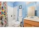 Cozy bathroom with shower-tub combo, stylish curtain, vanity, and white towel ready for use at 109 Troyer Pl, Apex, NC 27502