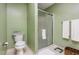 Bathroom features a glass-enclosed shower, toilet, and a basket for storage at 109 Troyer Pl, Apex, NC 27502