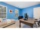 Bright bedroom featuring a bed, desk, large window and a comfortable seating area at 109 Troyer Pl, Apex, NC 27502