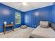 The stylish bedroom includes a bed, bedside table, and decorative wall art at 109 Troyer Pl, Apex, NC 27502