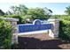 Carriage Downs sign in front of a landscape and building on a sunny day at 109 Troyer Pl, Apex, NC 27502