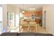 Bright eat-in kitchen features stainless steel appliances, a breakfast bar, and sliding glass doors to outside at 109 Troyer Pl, Apex, NC 27502