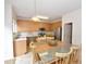 Bright eat-in kitchen features stainless steel appliances, a breakfast bar, and plenty of cabinet space at 109 Troyer Pl, Apex, NC 27502