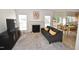 Inviting living room features a cozy fireplace and plenty of natural light at 109 Troyer Pl, Apex, NC 27502