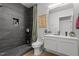 Modern bathroom featuring a tiled walk-in shower, sleek vanity, and contemporary fixtures at 1115 Sepelo Way, Efland, NC 27243