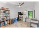 Organized bedroom with ceiling fan and desk setup, providing a comfortable and functional space at 1115 Sepelo Way, Efland, NC 27243