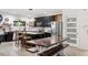 Eat in kitchen featuring a large island, stainless appliances, and seamless connection to the dining area at 1115 Sepelo Way, Efland, NC 27243