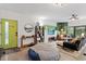 Inviting living area featuring a cozy sitting area, large windows, and an open floor plan perfect for relaxation at 1115 Sepelo Way, Efland, NC 27243