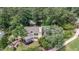 Aerial view of a beautiful property featuring the home, back yard, mature trees and landscaping at 112 Lancaster Dr, Chapel Hill, NC 27517