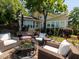 Cozy backyard patio with outdoor seating around a fire pit, perfect for entertaining at 112 Lancaster Dr, Chapel Hill, NC 27517