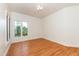Bedroom featuring hardwood floors, ample light, and a decorated ceiling at 112 Lancaster Dr, Chapel Hill, NC 27517