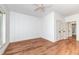 Bedroom featuring a ceiling fan, a closet, and wood floors at 112 Lancaster Dr, Chapel Hill, NC 27517
