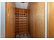 Wooden closet with custom built-in shelving and clothing rack at 112 Lancaster Dr, Chapel Hill, NC 27517