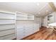 Walk-in closet features custom shelving and built-in drawers for storage solutions at 112 Lancaster Dr, Chapel Hill, NC 27517