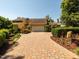 Charming home with a brick driveway, manicured bushes, and a basketball hoop at 112 Lancaster Dr, Chapel Hill, NC 27517