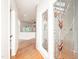 Hallway with hardwood floors and unique stained-glass windows at 112 Lancaster Dr, Chapel Hill, NC 27517