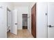 Hallway leading to a bathroom and a closet, providing convenient access to different areas at 112 Lancaster Dr, Chapel Hill, NC 27517