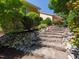 Landscaping with stone steps leading to the home through manicured shrubbery at 112 Lancaster Dr, Chapel Hill, NC 27517