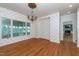 Living room featuring decorative wallpaper, hardwood floors, a chandelier, and an entryway at 112 Lancaster Dr, Chapel Hill, NC 27517