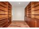 Spacious office featuring custom wooden built-in bookshelves and wood-look flooring at 112 Lancaster Dr, Chapel Hill, NC 27517