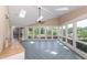 Sunroom with skylights, multiple windows offering abundant natural light, and tile flooring at 112 Lancaster Dr, Chapel Hill, NC 27517