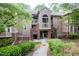 Charming condo exterior with brick accents and well-maintained landscaping at 115 Abingdon Ct # 2B, Cary, NC 27513