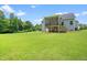Spacious backyard with a screened-in porch, ideal for outdoor gatherings and enjoying nature at 115 Jensen Dr, Wendell, NC 27591
