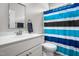 Well-lit bathroom featuring a single vanity and a shower-tub combination at 115 Jensen Dr, Wendell, NC 27591