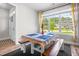 Bright dining area with a large window, bench seating, and attractive centerpiece at 115 Jensen Dr, Wendell, NC 27591