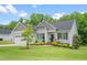 Well-maintained single-Gathering home with a lush green lawn and charming curb appeal on a sunny day at 115 Jensen Dr, Wendell, NC 27591