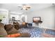 Comfortable living room showcasing a cozy seating arrangement and access to the modern kitchen at 115 Jensen Dr, Wendell, NC 27591