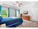 Bright main bedroom with hardwood dressers and a ceiling fan at 115 Jensen Dr, Wendell, NC 27591