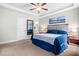 Comfortable main bedroom with plush carpet, tray ceiling, and neutral paint colors at 115 Jensen Dr, Wendell, NC 27591