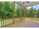 Relaxing screened porch offers an outdoor space with a view of the lush backyard and surrounding trees at 115 Jensen Dr, Wendell, NC 27591