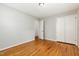 A bedroom featuring hardwood floors and closet space, providing comfortable and functional living at 1304 Park Ave, Dunn, NC 28334