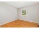 Inviting bedroom features hardwood floors and a sunlit window, creating a warm and welcoming ambiance at 1304 Park Ave, Dunn, NC 28334