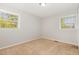Carpeted bedroom with sunlit windows, creating a cozy and inviting atmosphere at 1304 Park Ave, Dunn, NC 28334