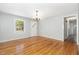 Bright dining room with hardwood floors, a chandelier, and lots of natural light at 1304 Park Ave, Dunn, NC 28334