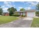 Beautiful one-story brick home with an attached garage and well-manicured front yard at 1304 Park Ave, Dunn, NC 28334