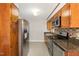 An efficient kitchen featuring stainless steel appliances, granite countertops, and mosaic backsplash at 1304 Park Ave, Dunn, NC 28334