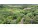 Expansive woodland property with a paved road for access, offering both privacy and convenience at 134 Chateau Rd, Durham, NC 27704