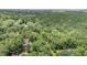 Woodland property featuring a home surrounded by lush trees and greenery for natural beauty and privacy at 134 Chateau Rd, Durham, NC 27704