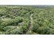 Scenic aerial view of a neighborhood with tree-lined streets and lush greenery at 134 Chateau Rd, Durham, NC 27704
