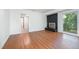 Basement living room with a fireplace, new flooring, and neutral paint at 134 Chateau Rd, Durham, NC 27704