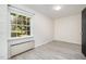 Bright bedroom features gray flooring, a window for natural light and baseboard heating at 134 Chateau Rd, Durham, NC 27704